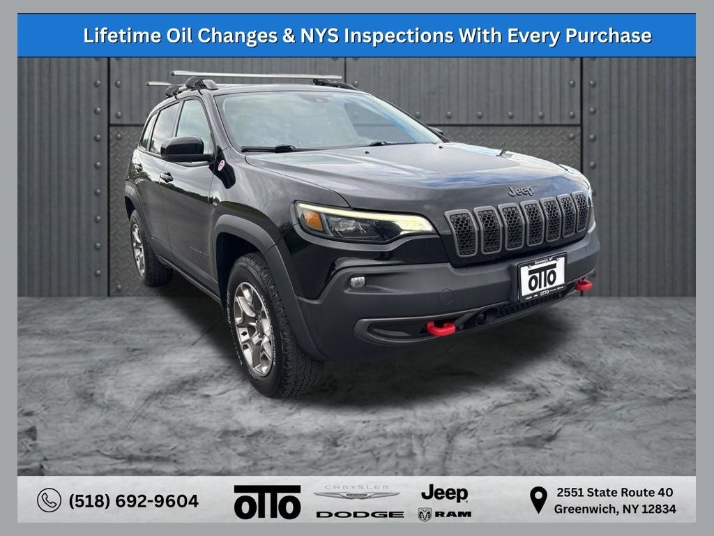 2022 Jeep Cherokee Trailhawk 4x4 in Diamond Black Crystal Pearlcoat — front three-quarter view