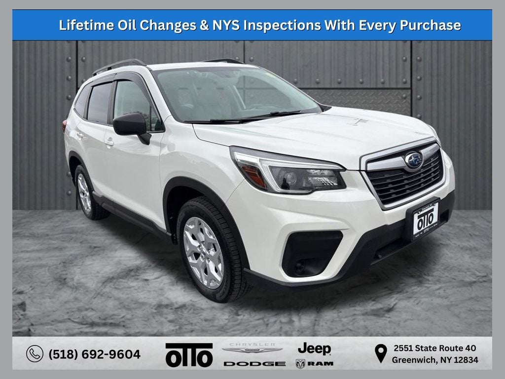 2021 Subaru Forester Base in Crystal White Pearl — front three-quarter view